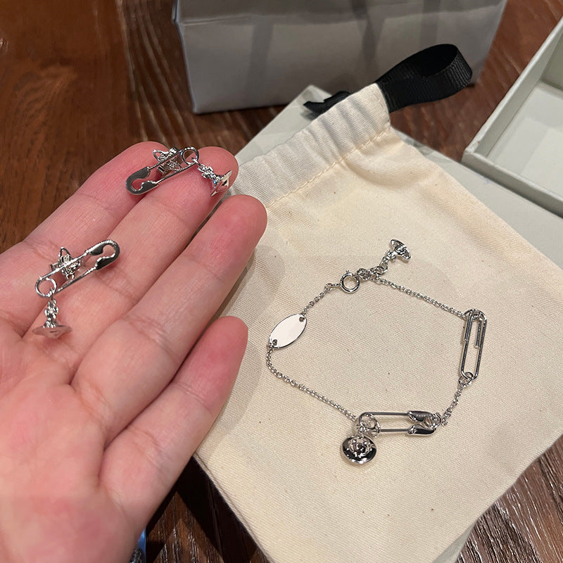 Queen Mother of the West pin three-dimensional Saturn stud earrings minimalist silver earrings pin bright paper clip planet daily earrings earrings