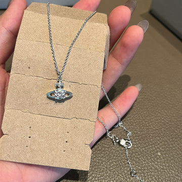 The new Reyna necklace classic shiny single diamond small Saturn planet pendant burst sparkle minimalist commuter style choker