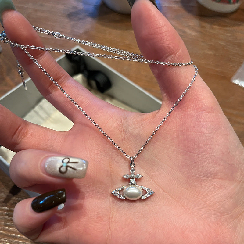 The high version of the Queen Mother of the West oval pearl necklace burst flash cross marquise diamond planet pendant clavicle chain live broadcast hit