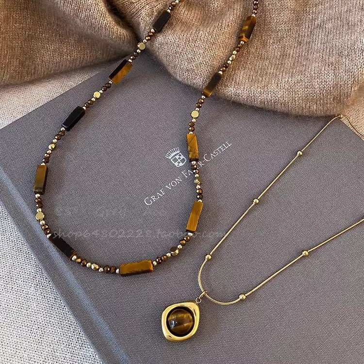 Maillard autumn and winter tiger's eye stone titanium steel necklace female Korean niche design long sweater chain accessories versatile new models