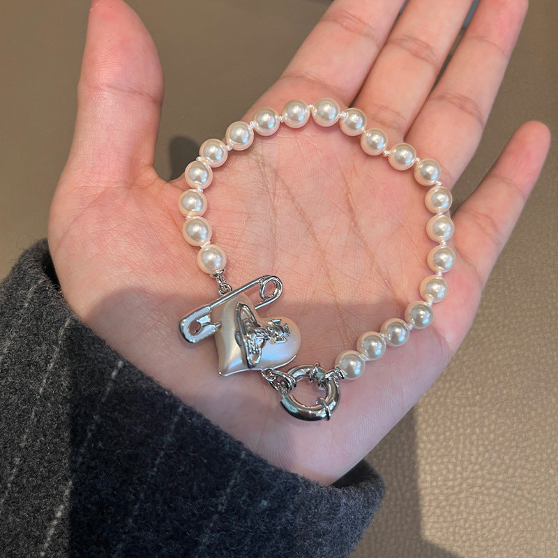 Seiko Queen West love pin pearl bracelet gold silver peach heart stud earrings niche fashionable hand ornament earrings