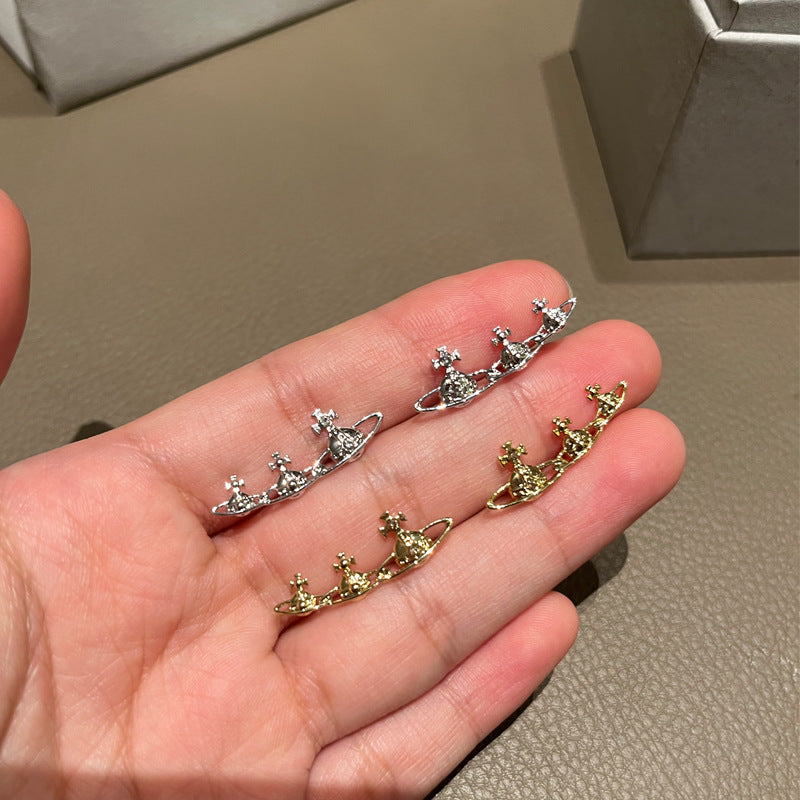 Three rows of Saturn stud earrings for the Queen Mother of the West gold and silver earrings