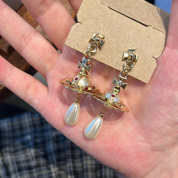 Queen Mother of the West water drop pearl earrings Seiko three-dimensional Saturn flying saucer large pearl stud earrings inlaid with colored diamond earrings