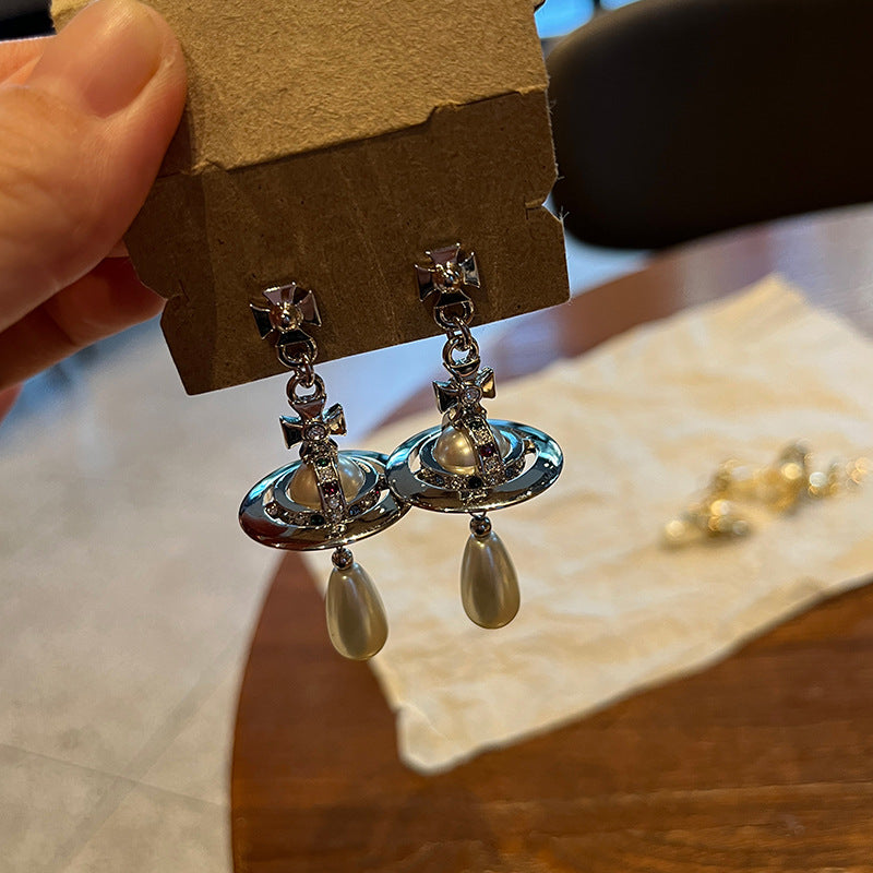 Queen Mother of the West water drop pearl earrings Seiko three-dimensional Saturn flying saucer large pearl stud earrings inlaid with colored diamond earrings