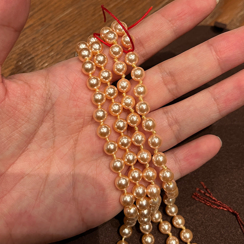 New Queen Mother West Champagne Gold Saturn Pearl Necklace Bracelet Champagne Pink Beads NANA with the same high-quality jewelry