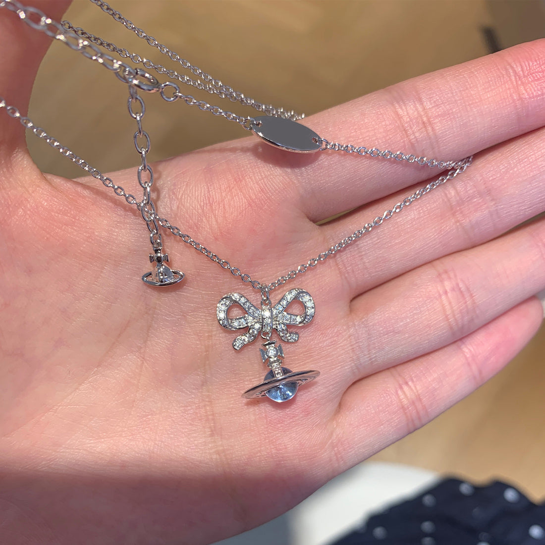 Queen Mother of the West glacier blue orb bow planet necklace earrings 925 silver girly sense Saturn pendant spring and summer new style